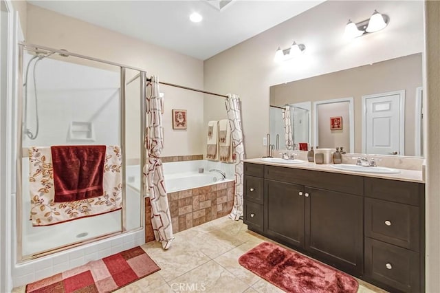 bathroom with vanity and independent shower and bath