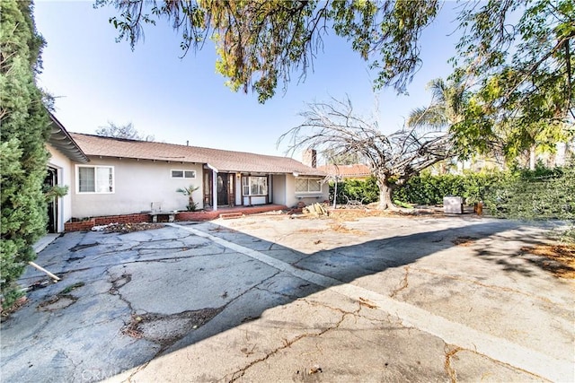 single story home featuring a patio