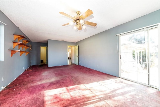 interior space featuring carpet floors and ceiling fan