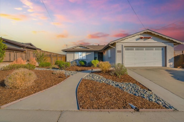 ranch-style home with a garage