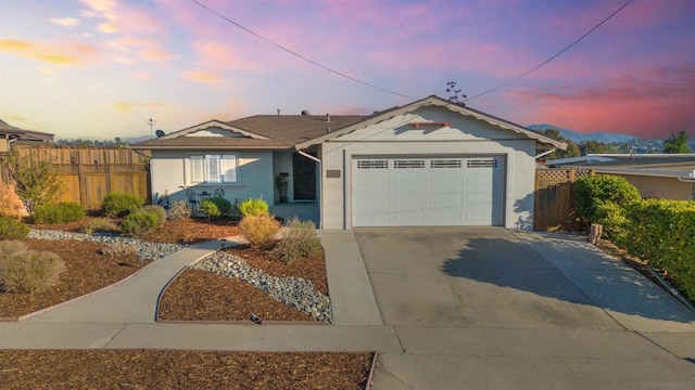 single story home with a garage