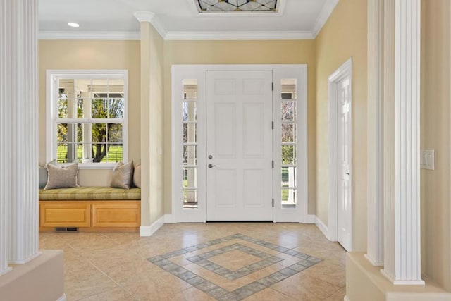 foyer entrance with plenty of natural light and ornamental molding