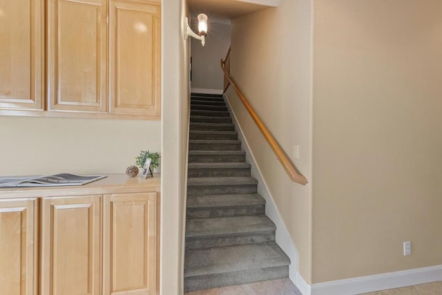 stairway with tile patterned flooring