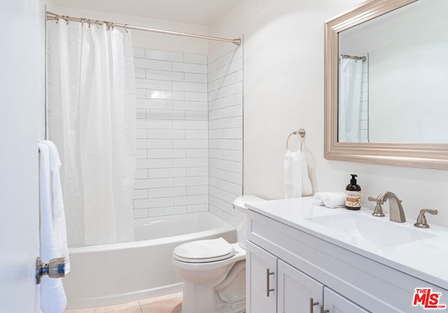 full bathroom featuring tile patterned flooring, vanity, shower / tub combo, and toilet