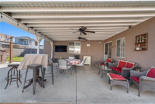 view of patio / terrace featuring ceiling fan and outdoor lounge area