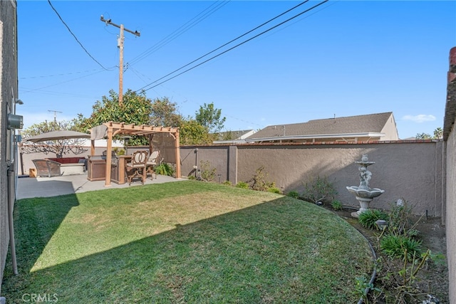 view of yard with a pergola and a patio