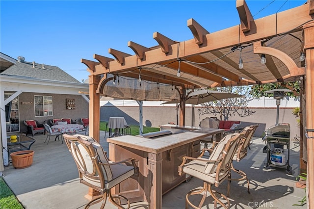 view of patio featuring area for grilling, an outdoor hangout area, and a bar