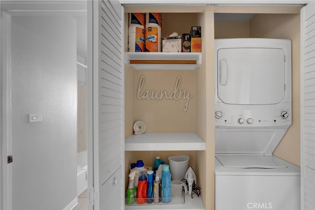 laundry room featuring stacked washer and clothes dryer