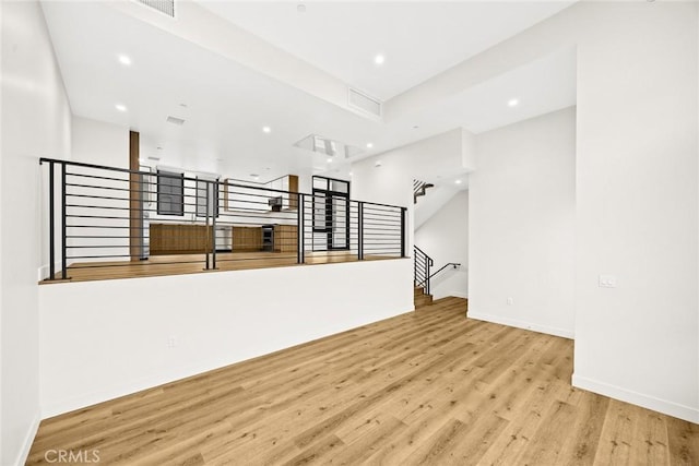 unfurnished living room featuring light hardwood / wood-style floors