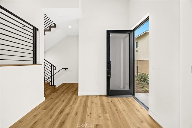 entrance foyer with light hardwood / wood-style flooring