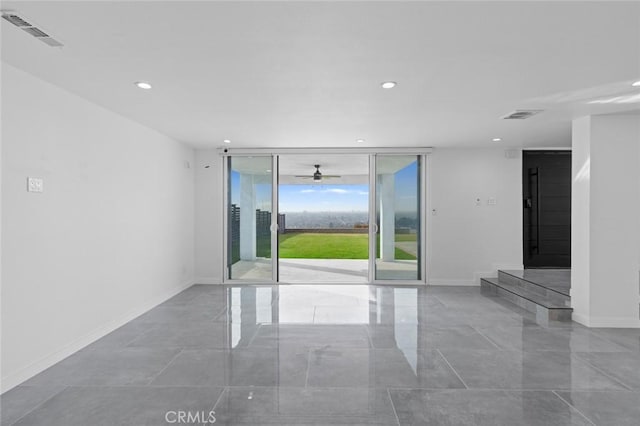 unfurnished room featuring floor to ceiling windows