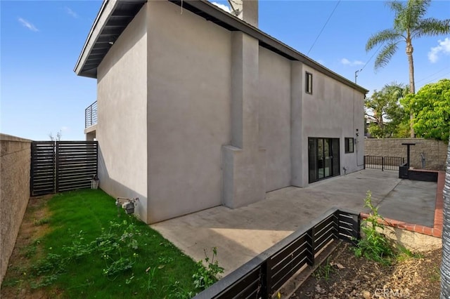 rear view of house featuring a patio