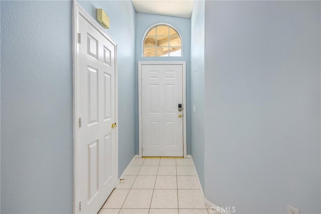 entryway featuring light tile patterned flooring