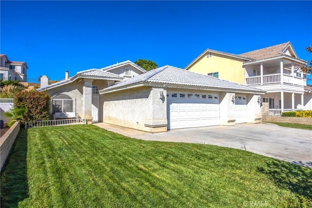 view of front of home with a garage and a front yard