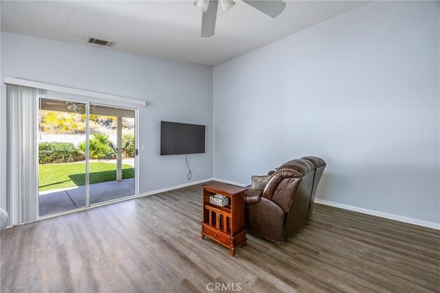 unfurnished room featuring dark hardwood / wood-style floors and ceiling fan