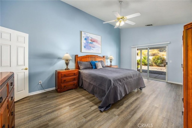 bedroom with ceiling fan, access to exterior, and dark hardwood / wood-style flooring