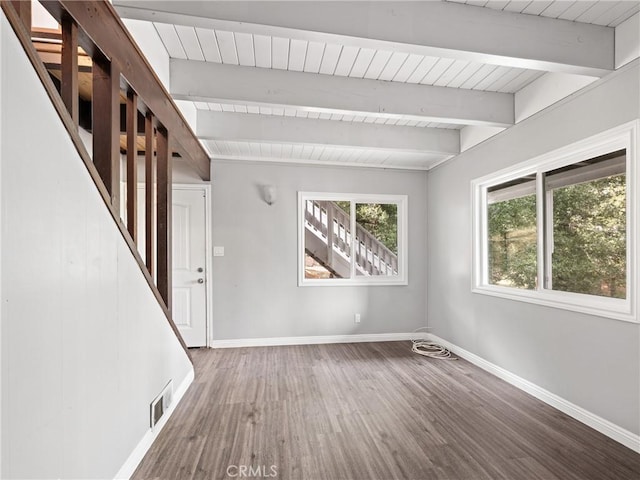 interior space featuring beam ceiling, a wealth of natural light, wooden ceiling, and hardwood / wood-style flooring