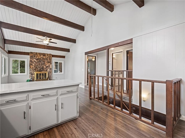 kitchen featuring white cabinetry, high vaulted ceiling, dark hardwood / wood-style floors, ceiling fan, and beam ceiling