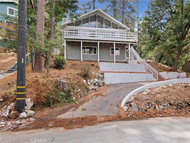 front of property with a wooden deck