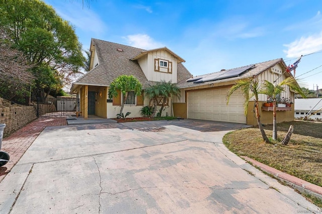 view of front of home featuring a garage and solar panels