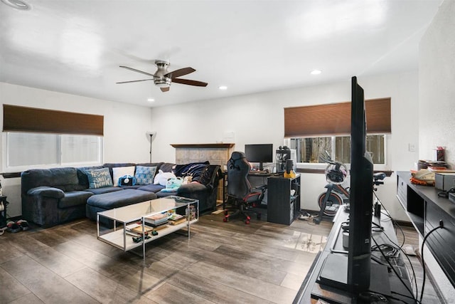 living room featuring hardwood / wood-style flooring and ceiling fan