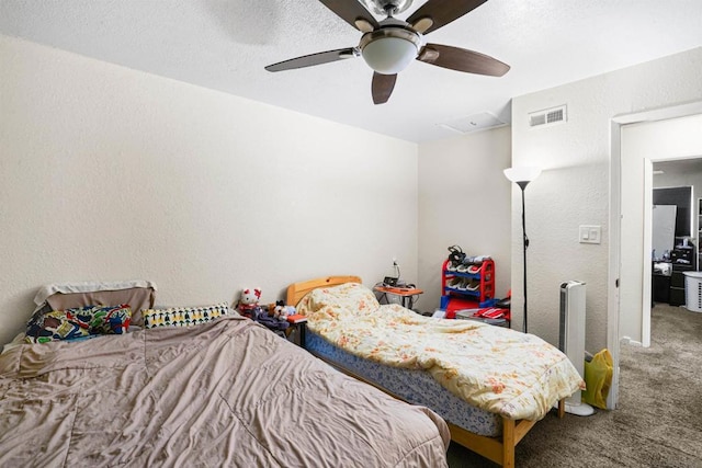 bedroom with ceiling fan and carpet flooring