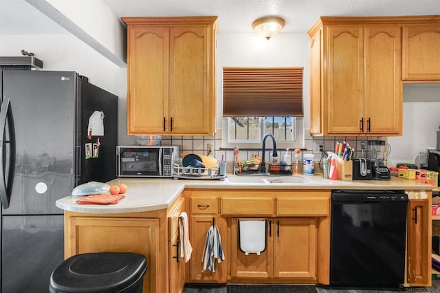 kitchen featuring tasteful backsplash, sink, and black appliances