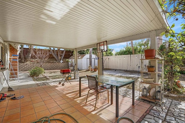 view of patio with a storage shed