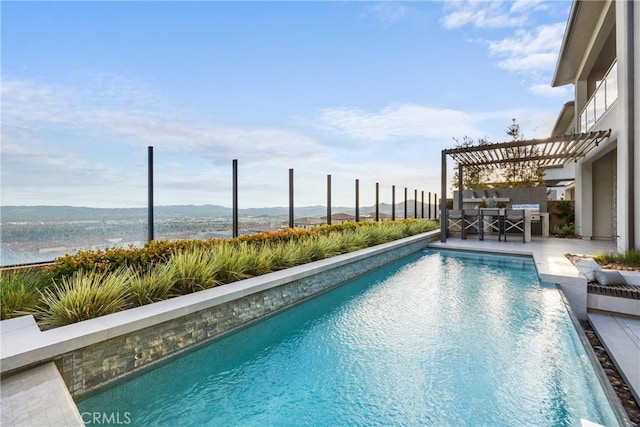 view of swimming pool featuring a water view, a pergola, and a patio area