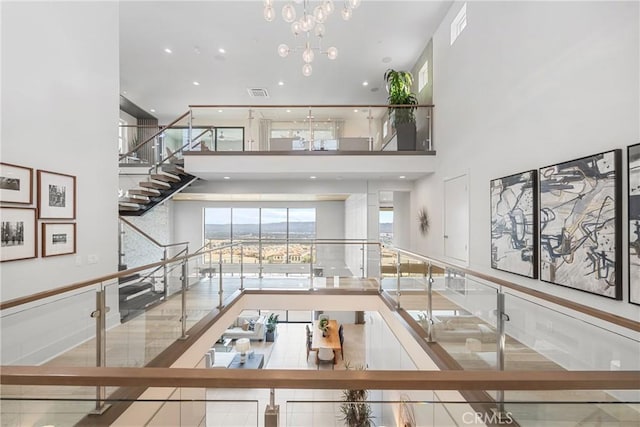 interior space featuring a high ceiling and a chandelier