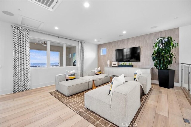 living room with light hardwood / wood-style flooring