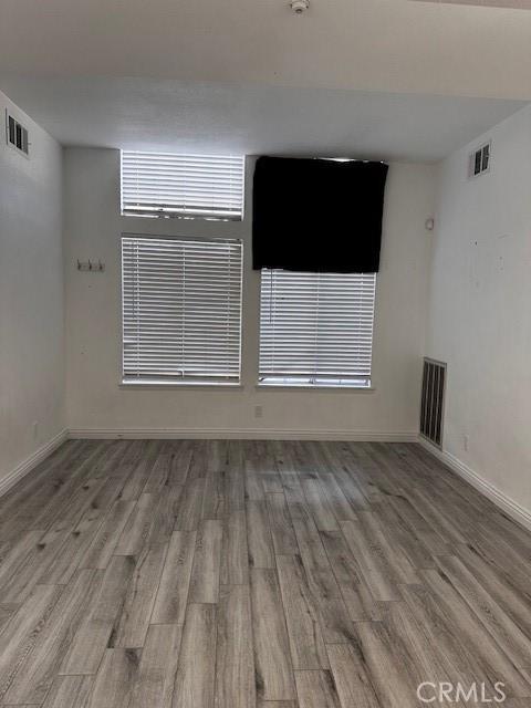 spare room with light hardwood / wood-style flooring