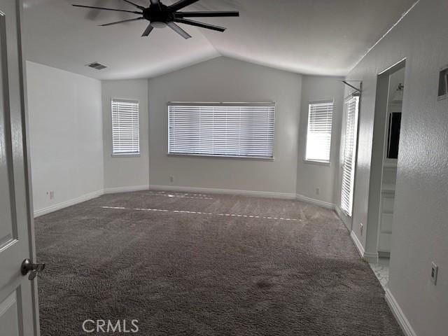 unfurnished room with lofted ceiling, carpet floors, and ceiling fan