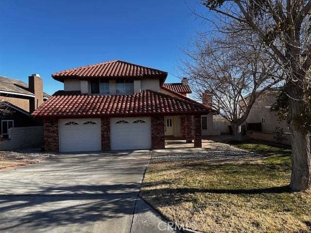 view of front facade with a garage and a front yard