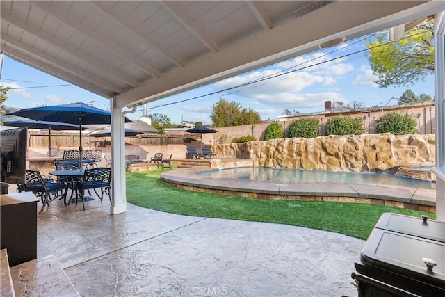 view of patio / terrace featuring pool water feature