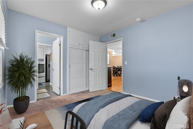 carpeted bedroom featuring connected bathroom