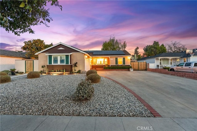 ranch-style home with solar panels