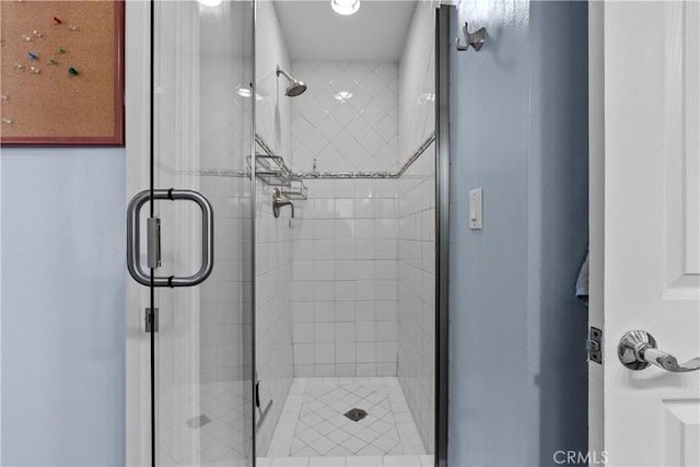 bathroom with a shower with shower door