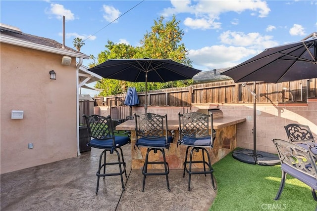 view of patio featuring a bar