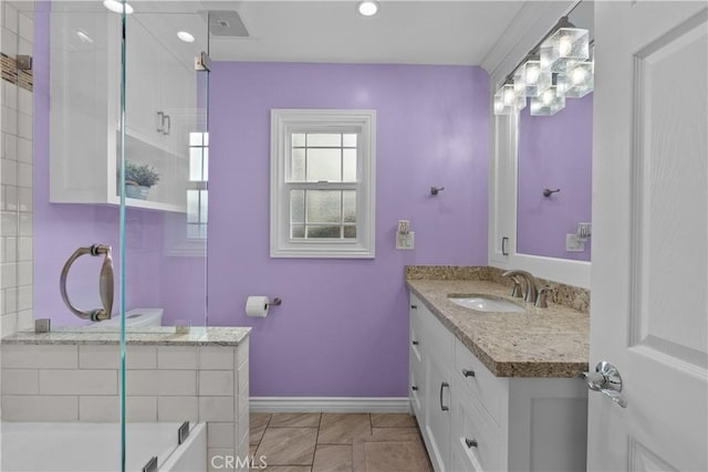 bathroom featuring vanity and shower / bath combination with glass door