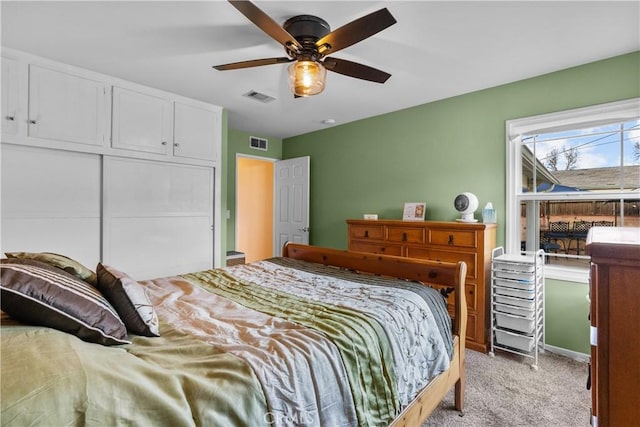 carpeted bedroom featuring ceiling fan