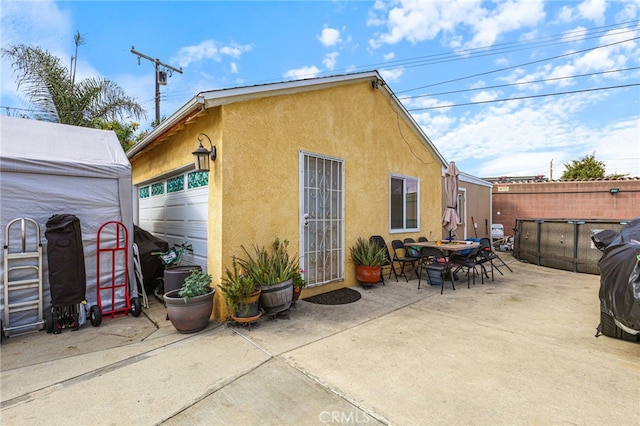 rear view of house with a patio