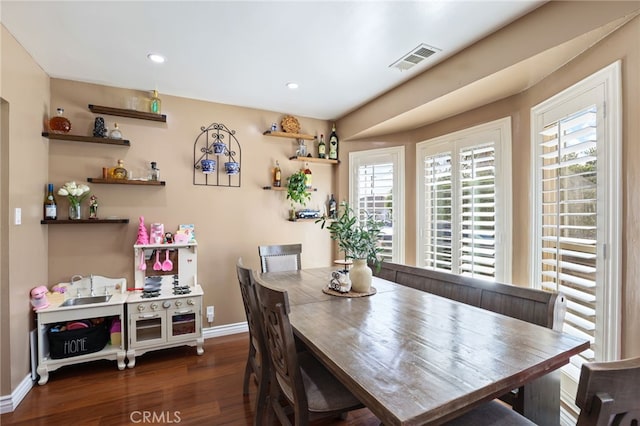 dining room with dark hardwood / wood-style floors