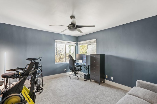 office space with light carpet and ceiling fan