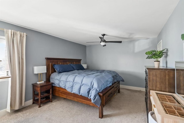 bedroom with light carpet and ceiling fan