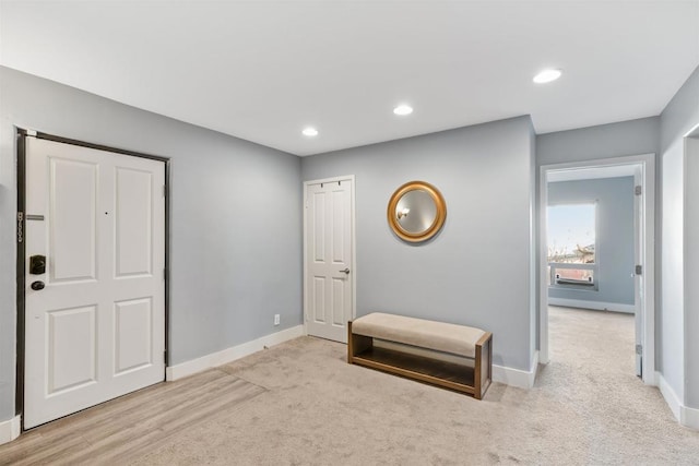 view of carpeted foyer entrance