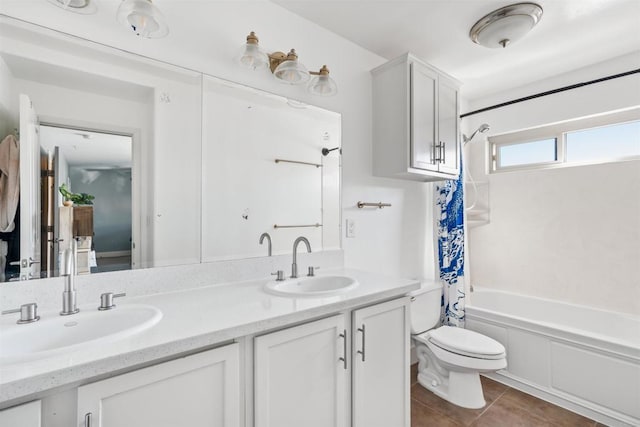 full bathroom with shower / tub combo with curtain, vanity, toilet, and tile patterned flooring