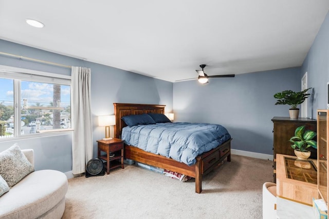 bedroom with carpet floors, ceiling fan, and baseboards