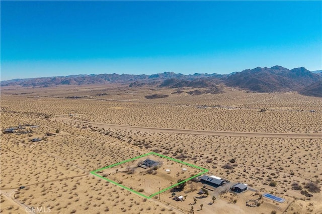 birds eye view of property with a mountain view