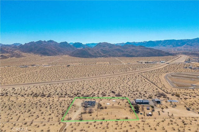 birds eye view of property featuring a mountain view